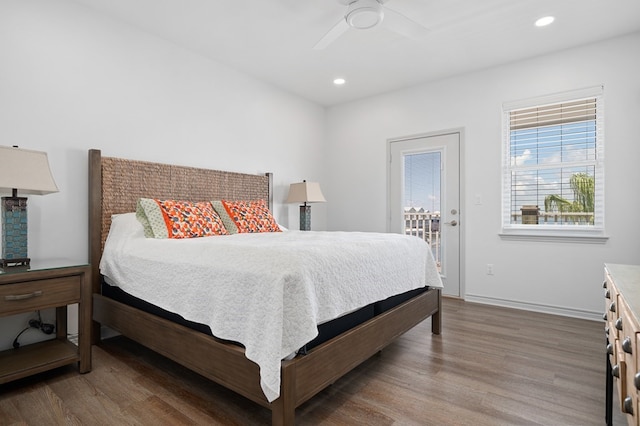 bedroom with access to exterior, ceiling fan, and hardwood / wood-style floors