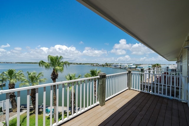 wooden deck with a water view