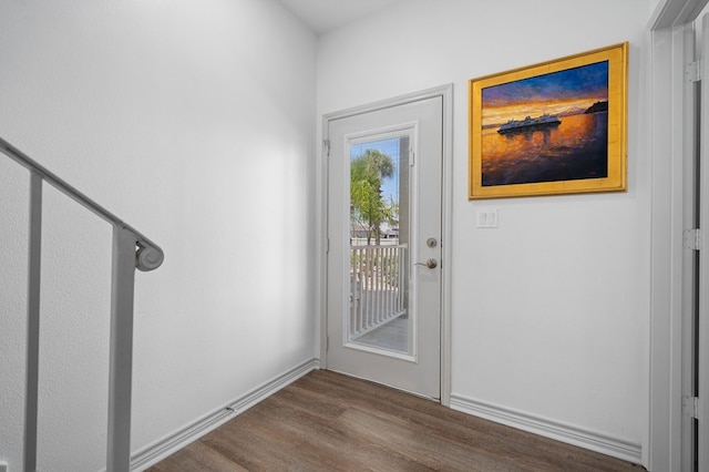 doorway with wood-type flooring