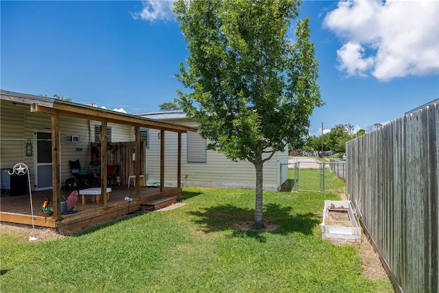1037 Collingswood Dr, Corpus Christi, TX 78412 - view of yard featuring a wooden deck and a garden