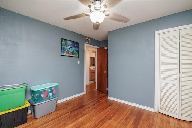 1037 Collingswood Dr, Corpus Christi, TX 78412 - bedroom with wood finished floors, a closet, and ceiling fan