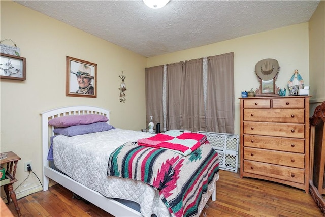 1037 Collingswood Dr, Corpus Christi, TX 78412 - bedroom with hardwood / wood-style flooring and a textured ceiling