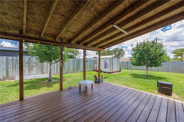 1037 Collingswood Dr, Corpus Christi, TX 78412 - wooden terrace with a storage unit and a fenced backyard