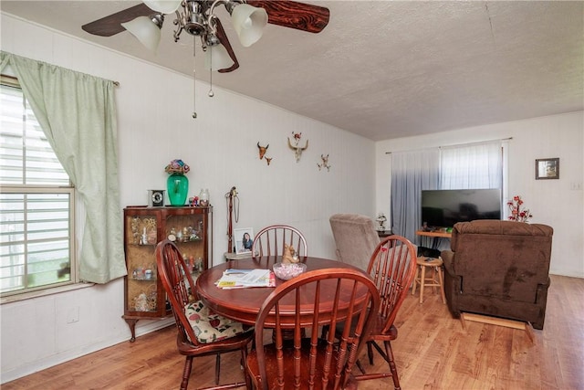 1037 Collingswood Dr, Corpus Christi, TX 78412 - dining space featuring wood finished floors, a textured ceiling, and a ceiling fan