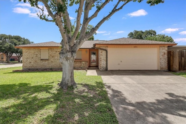 2854 Tumbleweed Dr, Corpus Christi, TX 78410 - ranch-style house featuring brick siding, an attached garage, and concrete driveway