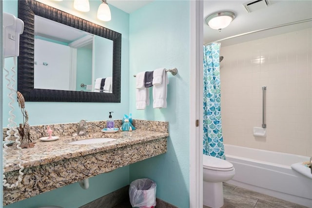 full bathroom with tile patterned flooring, toilet, sink, and shower / tub combo