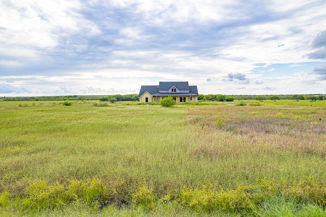 view of yard with a rural view