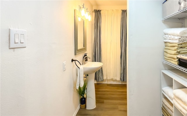 bathroom with wood-type flooring