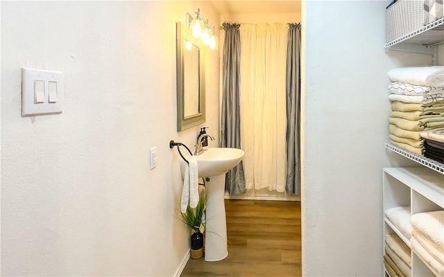 310 N Harrell, Bishop, TX 78343 - corridor featuring wood finished floors and baseboards