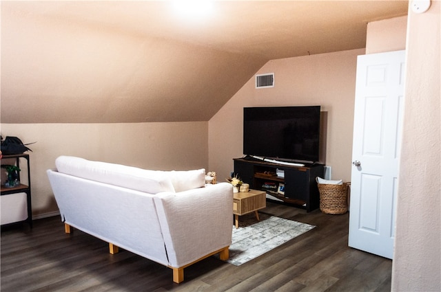 living room featuring dark wood-type flooring and lofted ceiling