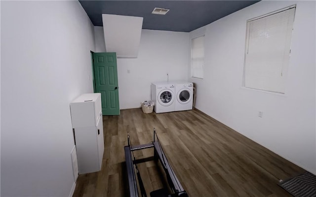 310 N Harrell, Bishop, TX 78343 - laundry area featuring washer and clothes dryer and wood finished floors