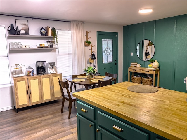 dining area featuring hardwood / wood-style floors and plenty of natural light