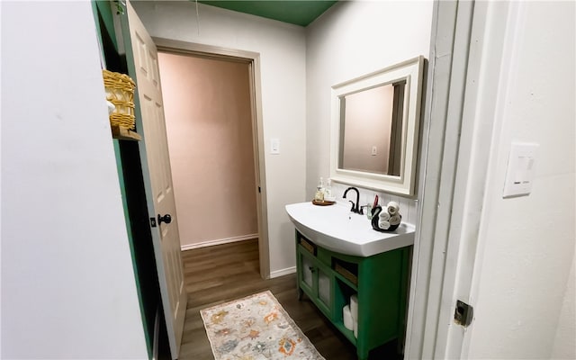 bathroom featuring hardwood / wood-style flooring and vanity