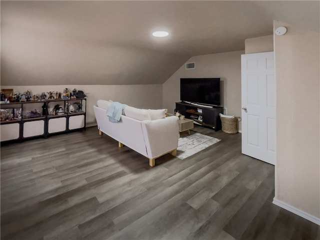 living room with lofted ceiling and dark hardwood / wood-style flooring