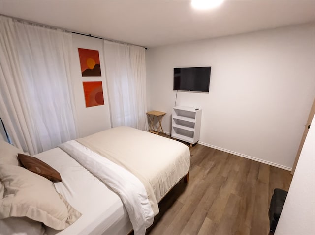 bedroom featuring hardwood / wood-style floors