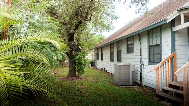 view of yard with central AC unit