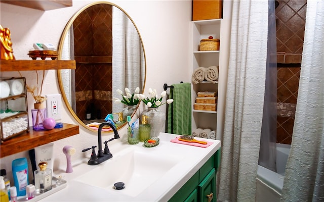 bathroom featuring shower / tub combo and vanity