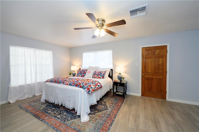 bedroom featuring light hardwood / wood-style flooring and ceiling fan