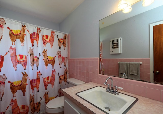 bathroom featuring a shower with curtain, vanity, toilet, and tile walls