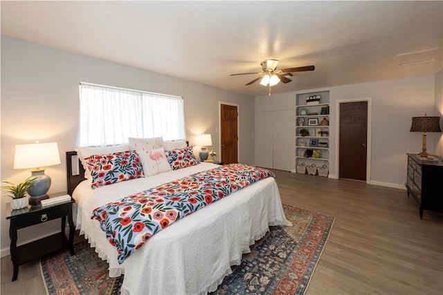 bedroom with hardwood / wood-style flooring and ceiling fan