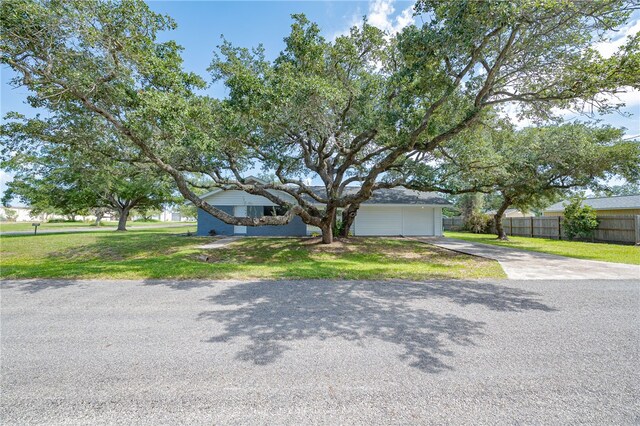 view of front of house with a garage and a front yard