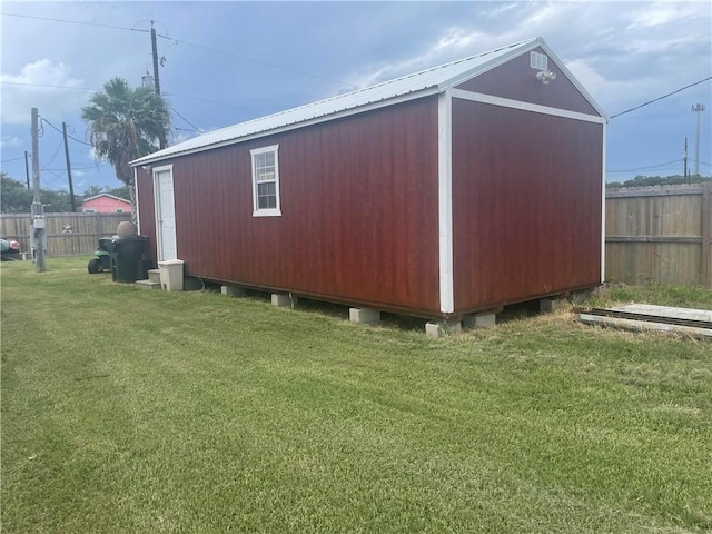 view of outdoor structure featuring a yard