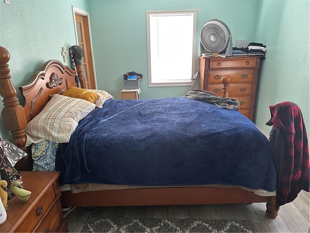 bedroom featuring hardwood / wood-style floors