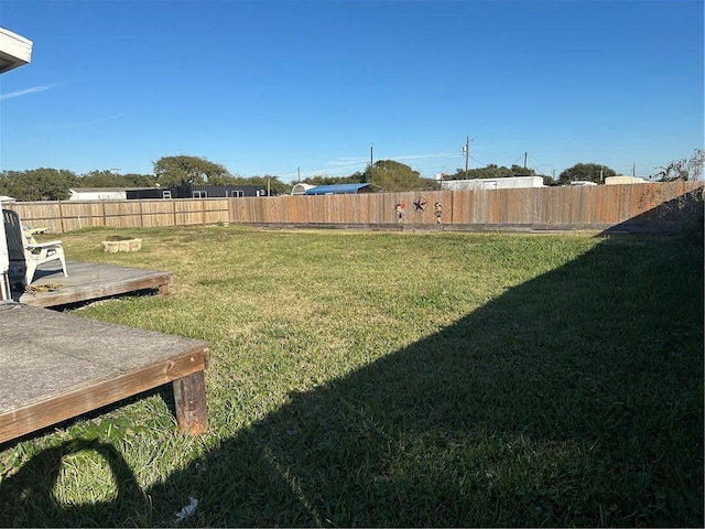 view of yard with a wooden deck