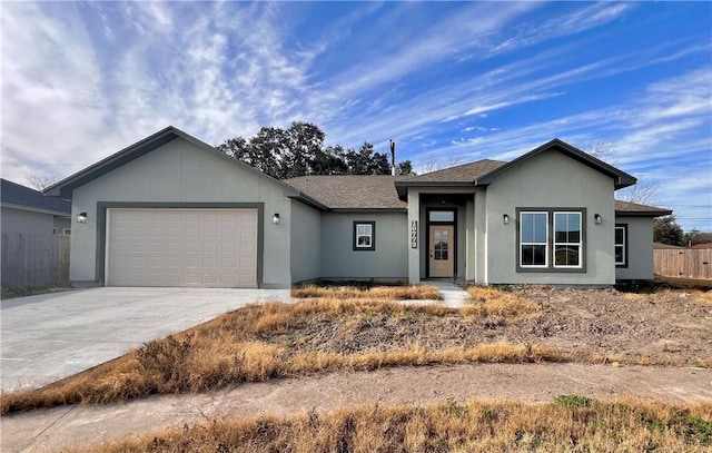 10773 Westview Dr, Corpus Christi, TX 78410 - ranch-style house with an attached garage, driveway, stucco siding, and fence