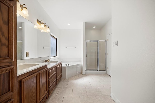 full bath featuring double vanity, a sink, a shower stall, a bath, and tile patterned floors