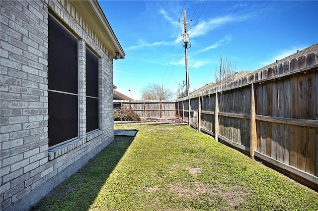 view of yard featuring a fenced backyard