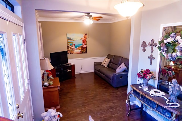 living area featuring crown molding, wood finished floors, and ceiling fan