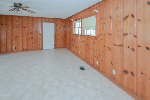 613 Brawner Pkwy, Corpus Christi, TX 78411 - empty room featuring a ceiling fan and wooden walls