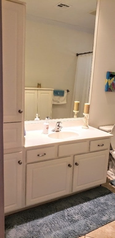 bathroom featuring vanity and curtained shower