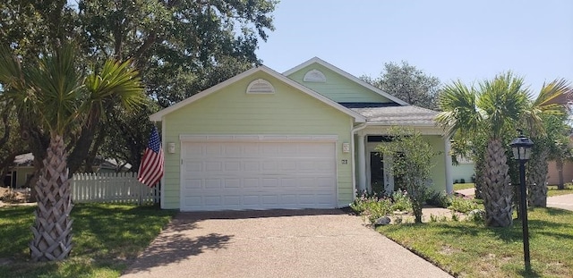 view of front facade featuring a garage and a front lawn