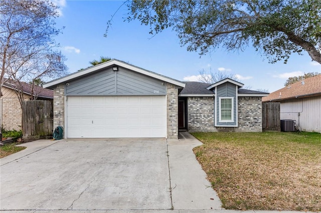 single story home featuring a front yard, cooling unit, and a garage