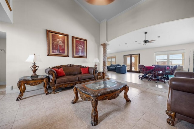 15849 El Soccorro, Corpus Christi, TX 78418 - living area featuring ceiling fan, light tile patterned floors, high vaulted ceiling, ornamental molding, and ornate columns