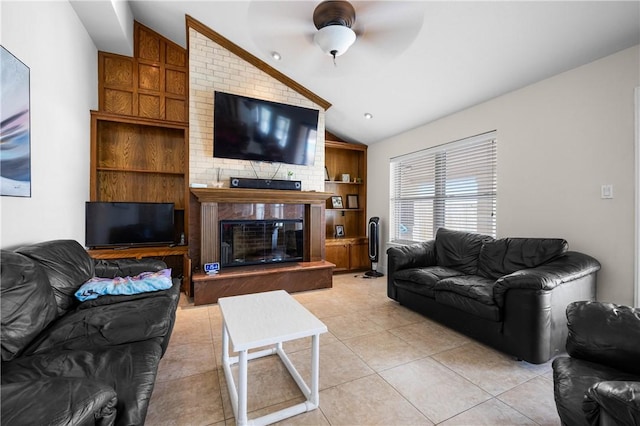 15849 El Soccorro, Corpus Christi, TX 78418 - living area featuring a brick fireplace, a ceiling fan, vaulted ceiling, and light tile patterned floors