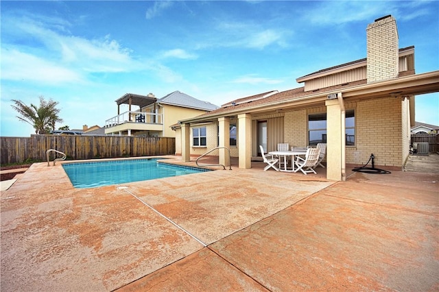 15849 El Soccorro, Corpus Christi, TX 78418 - view of swimming pool with central air condition unit, a fenced in pool, a fenced backyard, and a patio area