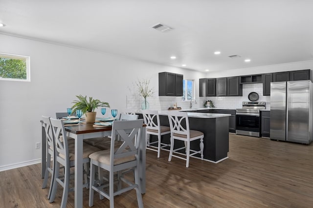 1179 Houston St S, Aransas Pass, TX 78336 - dining space with dark wood-style flooring and recessed lighting