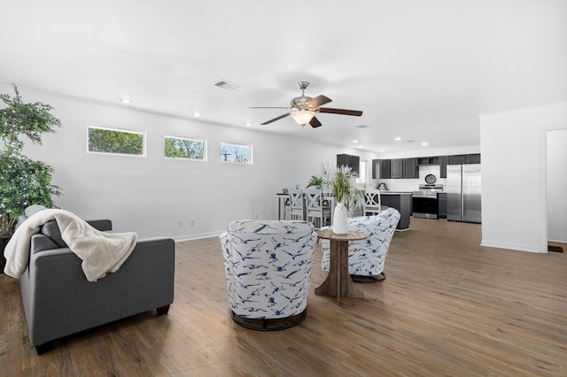 1179 Houston St S, Aransas Pass, TX 78336 - living room featuring ceiling fan, dark wood finished floors, and recessed lighting