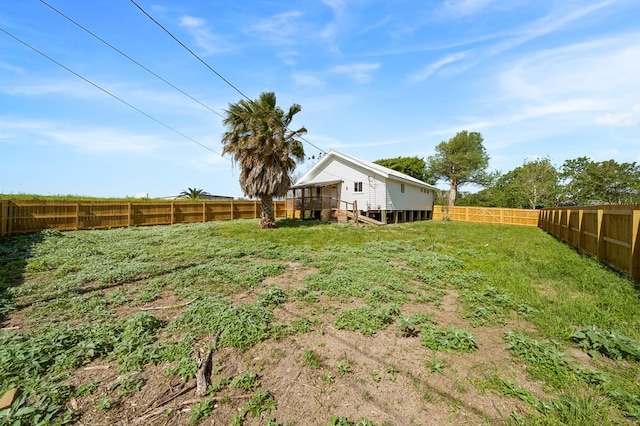 view of yard featuring a wooden deck