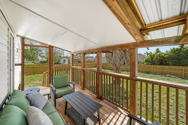 deck featuring an outdoor hangout area and a yard