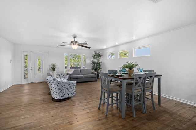 1179 Houston St S, Aransas Pass, TX 78336 - dining area featuring wood finished floors, ceiling fan, recessed lighting, and crown molding