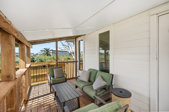 wooden terrace featuring an outdoor hangout area