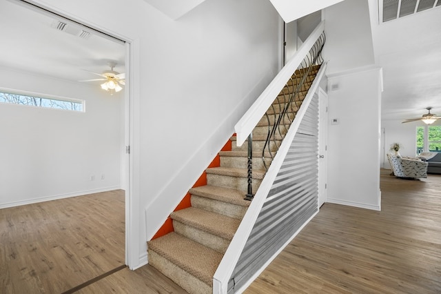1179 Houston St S, Aransas Pass, TX 78336 - staircase featuring a ceiling fan and wood finished floors