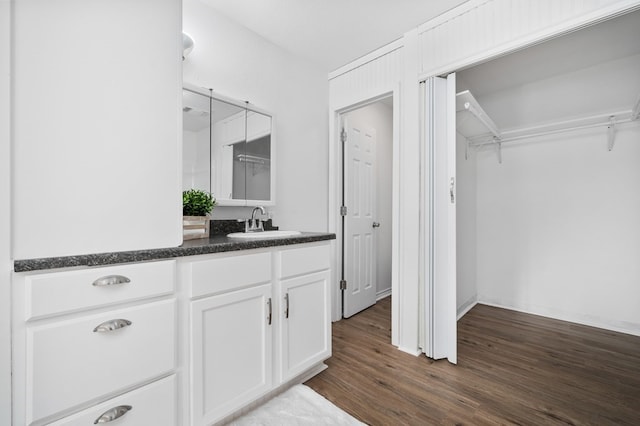 bathroom featuring hardwood / wood-style floors and vanity