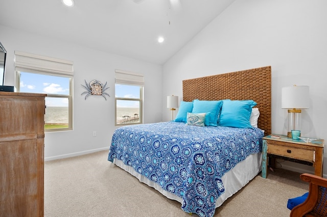 carpeted bedroom featuring lofted ceiling