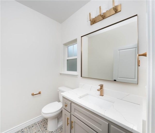 3618 Perry, Corpus Christi, TX 78410 - bathroom featuring toilet, baseboards, and vanity