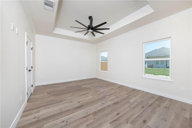 3618 Perry, Corpus Christi, TX 78410 - spare room with a raised ceiling, a ceiling fan, healthy amount of natural light, crown molding, and wood finished floors